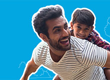 son on dad's shoulders