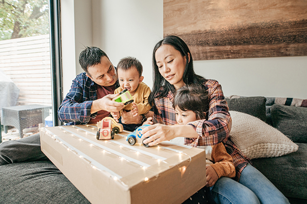 happy family playing with toys in house