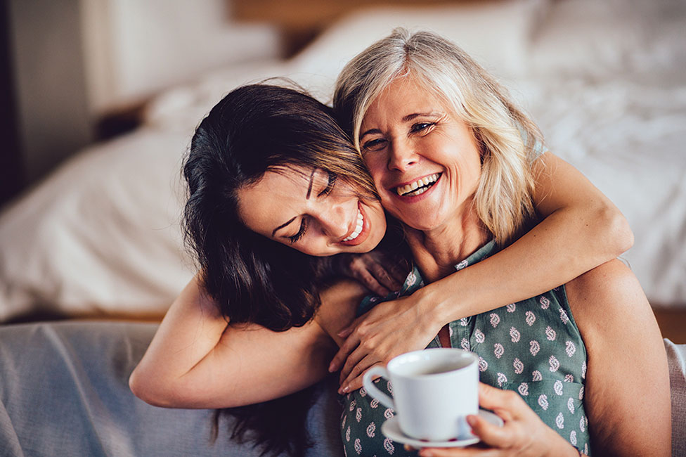 mother and daughter smiling