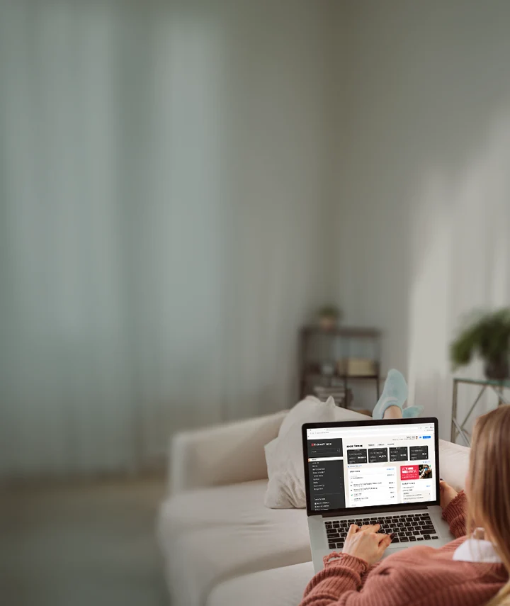 girl on laptop on couch