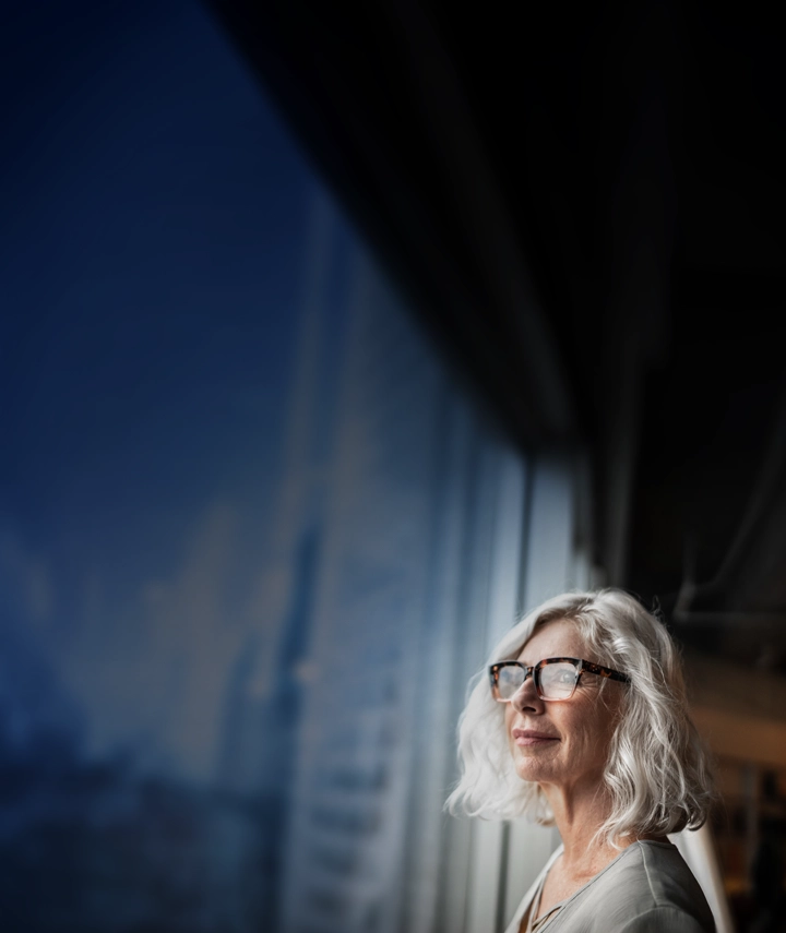 woman looking out window