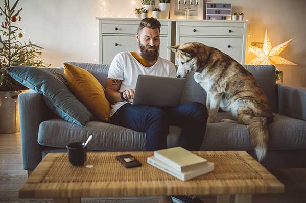 man on a couch with dog